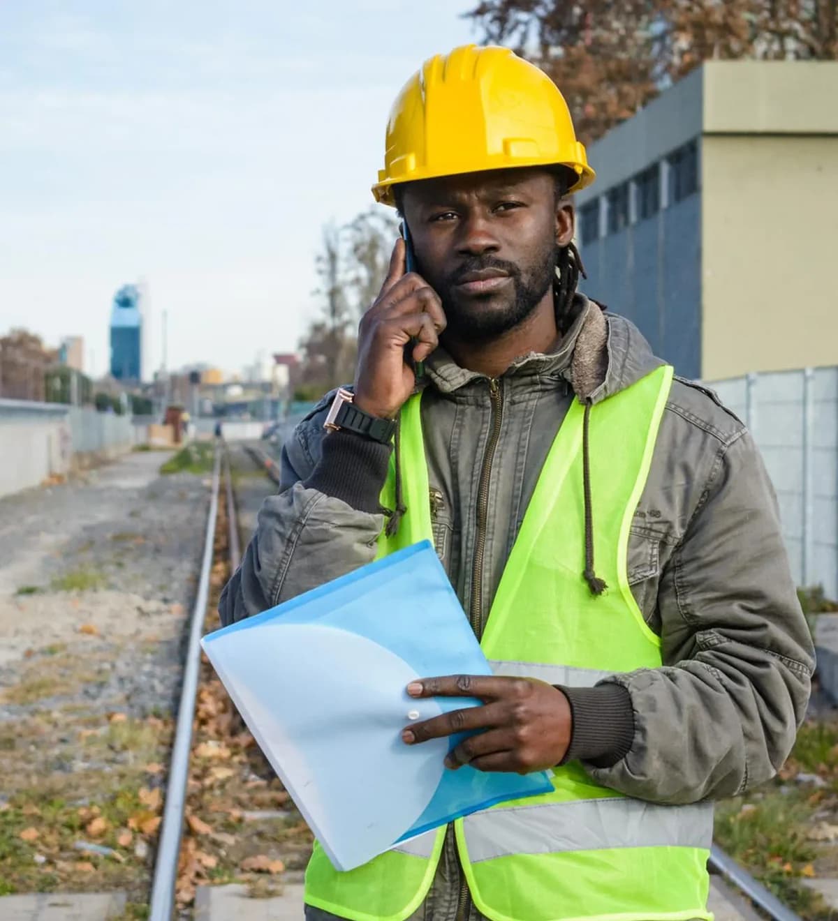 A property professional on site holding land documents